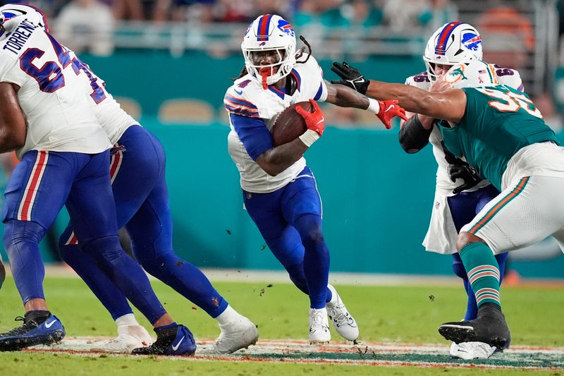 Buffalo Bills running back James Cook (4) runs for a touchdown during the first half of an NFL football game against the Miami Dolphins, Thursday, Sept. 12, 2024, in Miami Gardens, Fla. (AP Photo/Rebecca Blackwell)