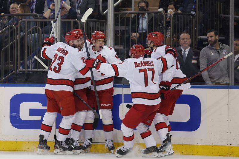 May 13, 2024; New York, New York, USA; Carolina Hurricanes center Evgeny Kuznetsov (92) celebrates his goal against the New York Rangers with teammates during the third period of game five of the second round of the 2024 Stanley Cup Playoffs at Madison Square Garden. Mandatory Credit: Brad Penner-USA TODAY Sports