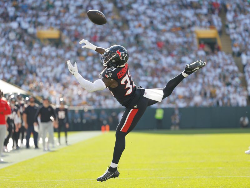 Houston Texans running back Dare Ogunbowale (33) can't come up with the ball against the Green Bay Packers during an NFL football game Sunday, Oct. 20, 2024, in Green Bay, Wis. (AP Photo/Jeffrey Phelps