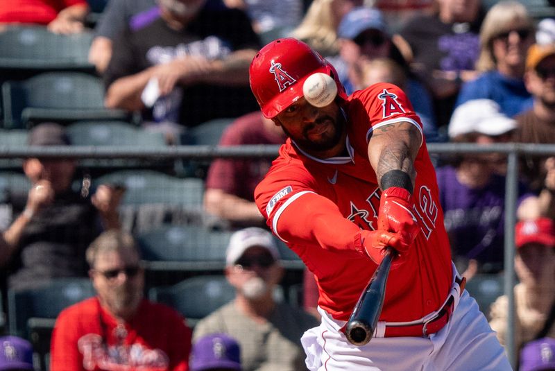 Mar 8, 2024; Tempe, Arizona, USA; Los Angeles Angels outfielder Aaron Hicks (12) watches his foul ball glance off his bat in the first during a spring training game against the Colorado Rockies at Tempe Diablo Stadium. Mandatory Credit: Allan Henry-USA TODAY Sports