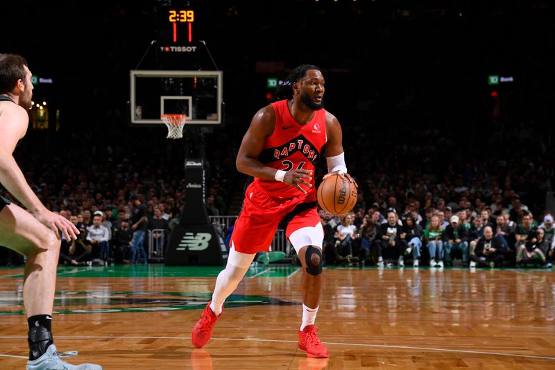 BOSTON, MA - NOVEMBER 16: Bruno Fernando #24 of the Toronto Raptors dribbles the ball during the game against the Boston Celtics on November 16, 2024 at TD Garden in Boston, Massachusetts. NOTE TO USER: User expressly acknowledges and agrees that, by downloading and/or using this Photograph, user is consenting to the terms and conditions of the Getty Images License Agreement. Mandatory Copyright Notice: Copyright 2024 NBAE (Photo by Brian Babineau/NBAE via Getty Images)