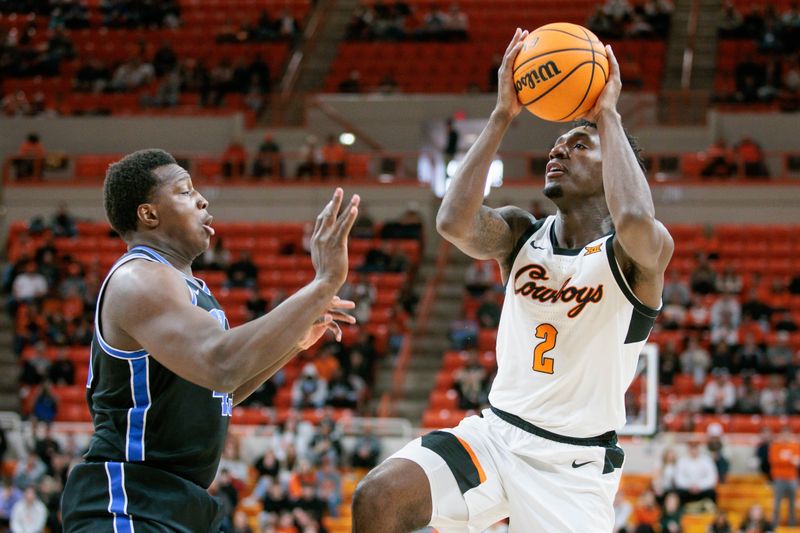 Feb 17, 2024; Stillwater, Oklahoma, USA; Oklahoma State Cowboys forward Eric Dailey Jr. (2) shoots the ball over Brigham Young Cougars forward Fousseyni Traore (45) during the first half at Gallagher-Iba Arena. Mandatory Credit: William Purnell-USA TODAY Sports