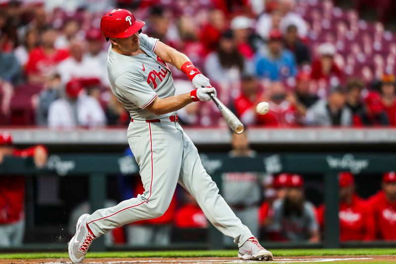 Apr 23, 2024; Cincinnati, Ohio, USA; Philadelphia Phillies catcher J.T. Realmuto (10) hits a double against the Cincinnati Reds in the first inning at Great American Ball Park. Mandatory Credit: Katie Stratman-USA TODAY Sports