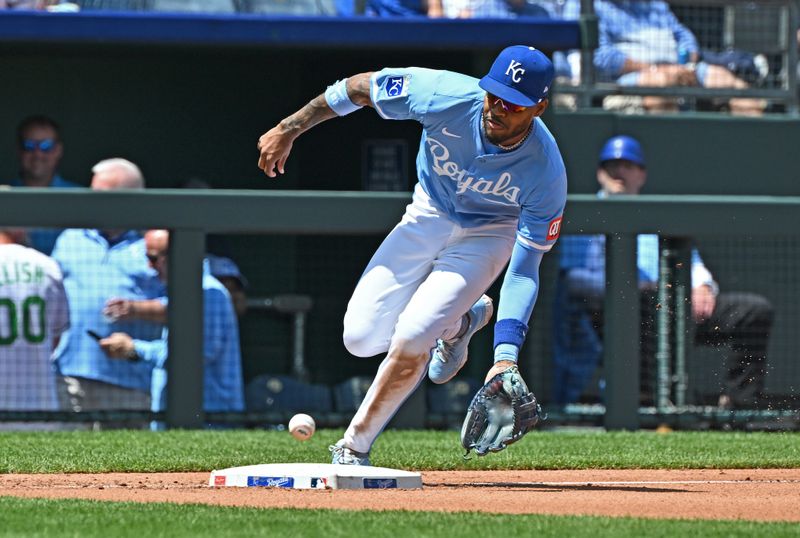 May 8, 2024; Kansas City, Missouri, USA;  Kansas City Royals third baseman Maikel Garcia (11) fields a ground ball in the third inning against the Milwaukee Brewers at Kauffman Stadium. Mandatory Credit: Peter Aiken-USA TODAY Sports