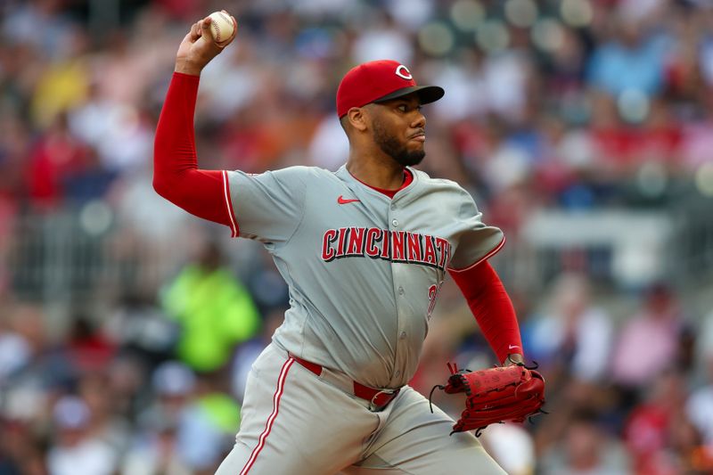 Jul 22, 2024; Atlanta, Georgia, USA; Cincinnati Reds starting pitcher Hunter Greene (21) throws against the Atlanta Braves in the second inning at Truist Park. Mandatory Credit: Brett Davis-USA TODAY Sports