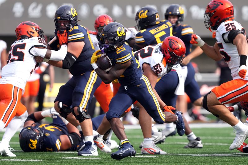 Oct 26, 2024; Berkeley, California, USA; California Golden Bears running back Jaivian Thomas (25) carries the ball against the Oregon State Beavers during the second quarter at California Memorial Stadium. Mandatory Credit: Darren Yamashita-Imagn Images
