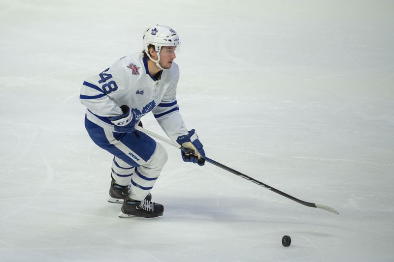 Dec 7, 2023; Ottawa, Ontario, CAN; Toronto Maple Leafs defenseman Max Lajoie (48) skates with the puck in the third period against the Ottawa Senators at the Canadian Tire Centre. Mandatory Credit: Marc DesRosiers-USA TODAY Sports