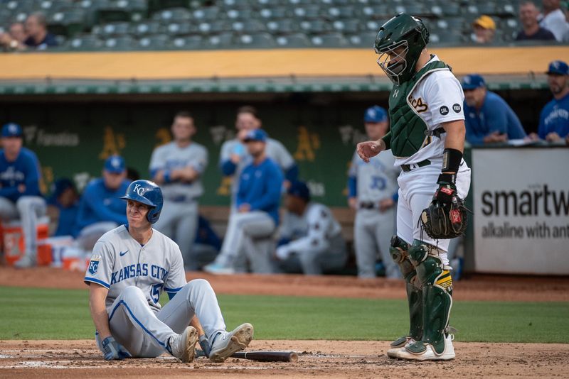 Aug 22, 2023; Oakland, California, USA; Kansas City Royals first baseman Matt Duffy (15) sits down at home plate after avoiding a pitch during the second inningagainst the Oakland Athletics at Oakland-Alameda County Coliseum. Mandatory Credit: Ed Szczepanski-USA TODAY Sports