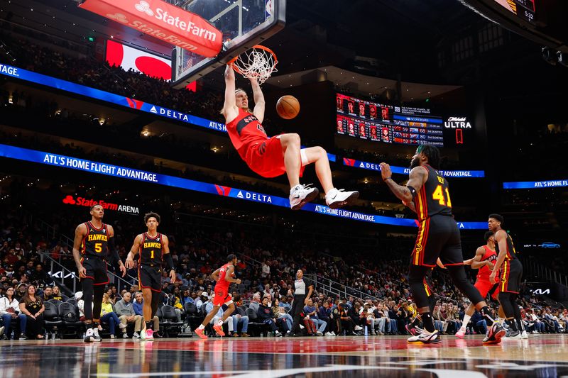 ATLANTA, GEORGIA - FEBRUARY 23: Kelly Olynyk #41 of the Toronto Raptors dunks during the third quarter against the Atlanta Hawks at State Farm Arena on February 23, 2024 in Atlanta, Georgia. NOTE TO USER: User expressly acknowledges and agrees that, by downloading and or using this photograph, User is consenting to the terms and conditions of the Getty Images License Agreement. (Photo by Todd Kirkland/Getty Images)