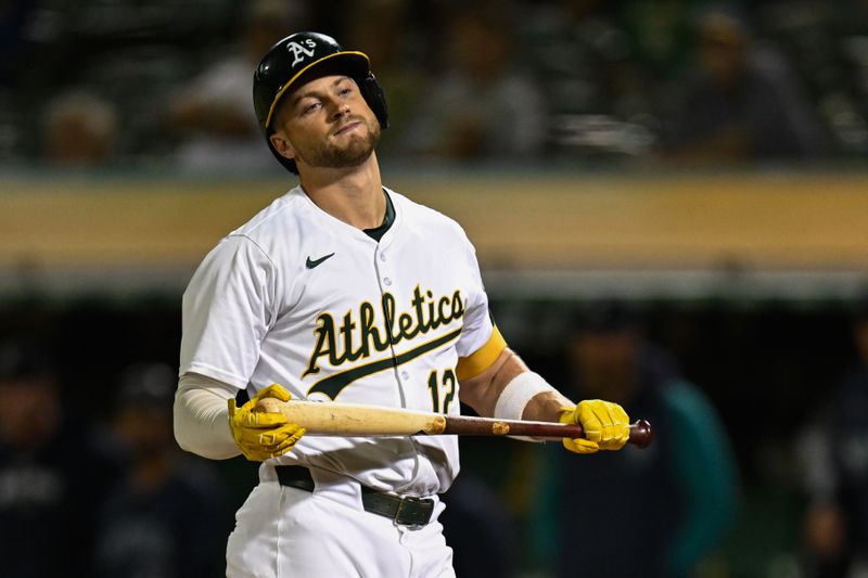 Sep 4, 2024; Oakland, California, USA; Oakland Athletics third baseman Max Schuemann (12) reacts after striking out against the Seattle Mariners in the fifth inning at Oakland-Alameda County Coliseum. Mandatory Credit: Eakin Howard-Imagn Images