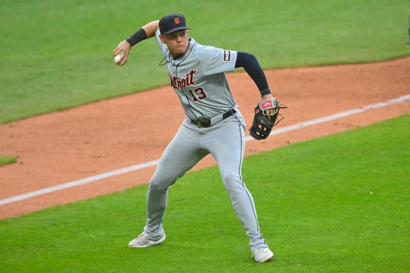 Jul 23, 2024; Cleveland, Ohio, USA; Detroit Tigers third baseman Gio Urshela (13) looks to first base in the sixth inning against the Cleveland Guardians at Progressive Field. Mandatory Credit: David Richard-USA TODAY Sports