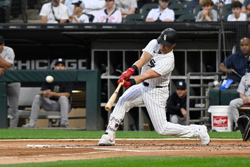 Aug 14, 2024; Chicago, Illinois, USA;  Chicago White Sox outfielder Andrew Benintendi (23) hits his 1000th MLB hit with a double against the New York Yankees during the first inning at Guaranteed Rate Field. Mandatory Credit: Matt Marton-USA TODAY Sports