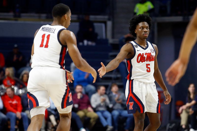 Dec 5, 2023; Oxford, Mississippi, USA; Mississippi Rebels guard Jaylen Murray (5) reacts with guard Matthew Murrell (11) during the second half against the Mount St. Mary's Mountaineers at The Sandy and John Black Pavilion at Ole Miss. Mandatory Credit: Petre Thomas-USA TODAY Sports