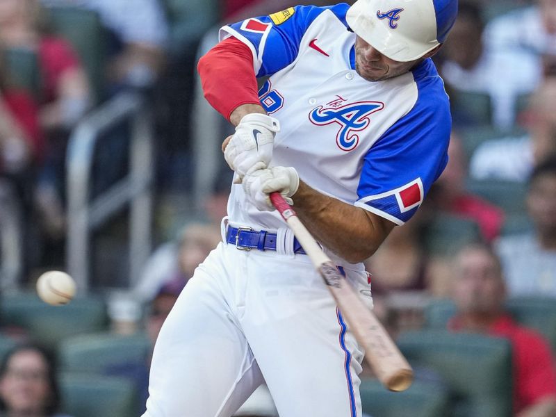 Jul 29, 2023; Cumberland, Georgia, USA; Atlanta Braves first baseman Matt Olson (28) singles to drive in a run against the Milwaukee Brewers during the first inning at Truist Park. Mandatory Credit: Dale Zanine-USA TODAY Sports