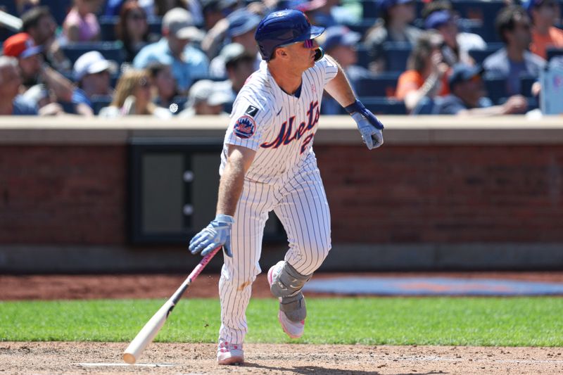 May 11, 2025; New York City, New York, USA; New York Mets first baseman Pete Alonso (20) hits a double during the eighth inning against the Chicago Cubs at Citi Field. Mandatory Credit: Vincent Carchietta-Imagn Images