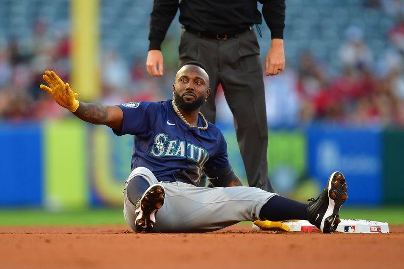 Aug 30, 2024; Anaheim, California, USA; Seattle Mariners left fielder Randy Arozarena (56) reaches second on a double against the Los Angeles Angels during the first inning at Angel Stadium. Mandatory Credit: Gary A. Vasquez-USA TODAY Sports