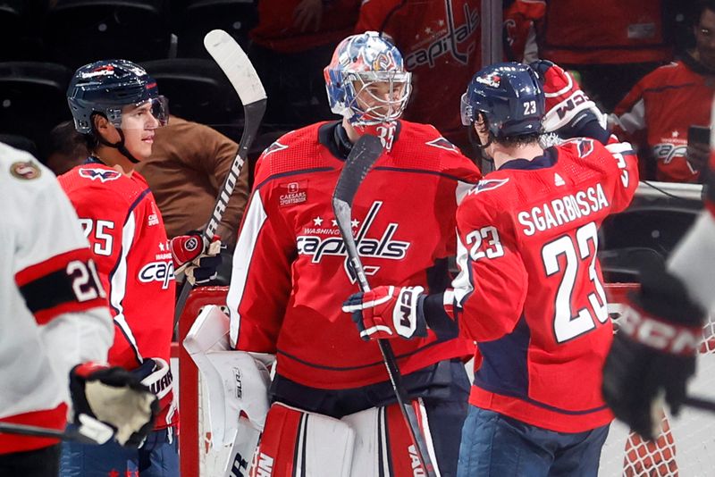 Feb 26, 2024; Washington, District of Columbia, USA; Washington Capitals goaltender Darcy Kuemper (35) celebrates with teammates after their game against the Ottawa Senators at Capital One Arena. Mandatory Credit: Geoff Burke-USA TODAY Sports