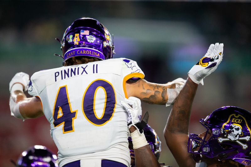 Oct 10, 2020; Tampa, Florida, USA;  East Carolina Pirates running back Darius Pinnix Jr. (40) celebrates after scoring a touchdown during the first quarter of a game against the South Florida Bulls at Raymond James Stadium. Mandatory Credit: Mary Holt-USA TODAY Sports