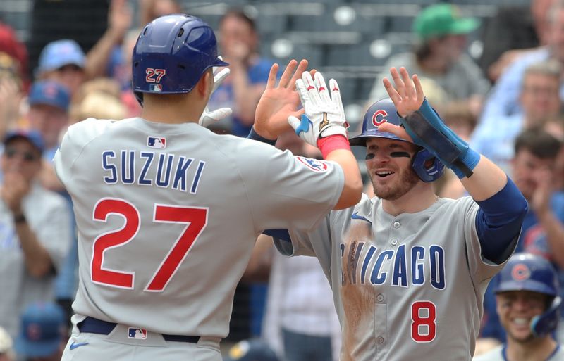 May 1, 2025; Pittsburgh, Pennsylvania, USA;  Chicago Cubs left fielder Ian Happ (8) congratulates designated hitter Seiya Suzuki (27) on his two run home run against the Pittsburgh Pirates during the seventh inning at PNC Park. Mandatory Credit: Charles LeClaire-Imagn Images