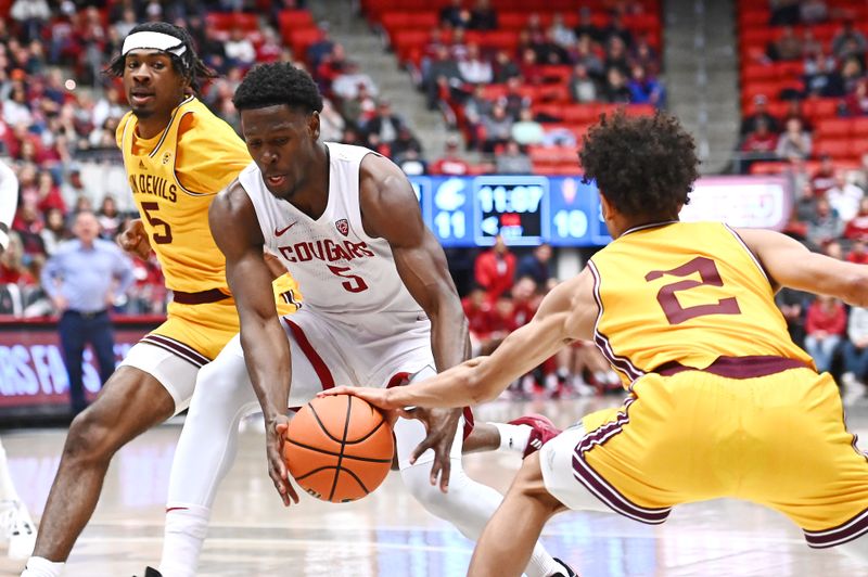 Jan 28, 2023; Pullman, Washington, USA; Arizona State Sun Devils guard Austin Nunez (2) strips the ball away from Washington State Cougars guard TJ Bamba (5) in the first half at Friel Court at Beasley Coliseum. Mandatory Credit: James Snook-USA TODAY Sports