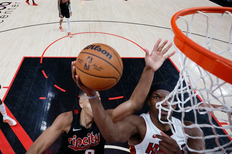 PORTLAND, OREGON - FEBRUARY 27: Jimmy Butler #22 of the Miami Heat shoots the ball against Kris Murray #8 of the Portland Trail Blazers during the second half at Moda Center on February 27, 2024 in Portland, Oregon. NOTE TO USER: User expressly acknowledges and agrees that, by downloading and or using this photograph, User is consenting to the terms and conditions of the Getty Images License Agreement. (Photo by Soobum Im/Getty Images)