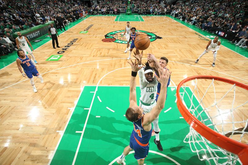 BOSTON, MA - APRIL 11: Jrue Holiday #4 of the Boston Celtics shoots the ball during the game against the New York Knicks on April 11, 2024 at the TD Garden in Boston, Massachusetts. NOTE TO USER: User expressly acknowledges and agrees that, by downloading and or using this photograph, User is consenting to the terms and conditions of the Getty Images License Agreement. Mandatory Copyright Notice: Copyright 2024 NBAE  (Photo by Nathaniel S. Butler/NBAE via Getty Images)