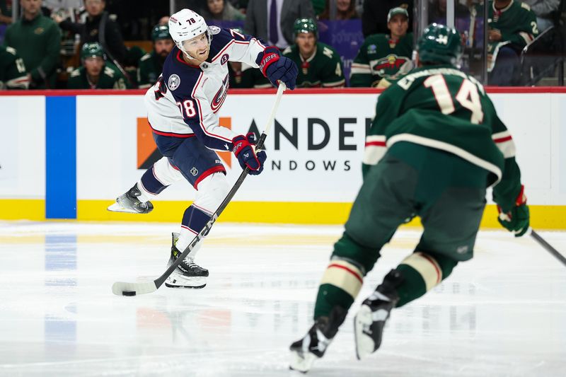 Oct 10, 2024; Saint Paul, Minnesota, USA; Columbus Blue Jackets defenseman Damon Severson (78) shoots the puck as Minnesota Wild center Joel Eriksson Ek (14) defends during the third period at Xcel Energy Center. Mandatory Credit: Matt Krohn-Imagn Images