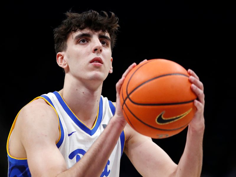 Dec 20, 2023; Pittsburgh, Pennsylvania, USA; Pittsburgh Panthers forward Guillermo Diaz Graham (25) shoots a free throw against the IPFW Mastodons during the second half at the Petersen Events Center. Pittsburgh won 62-48. Mandatory Credit: Charles LeClaire-USA TODAY Sports