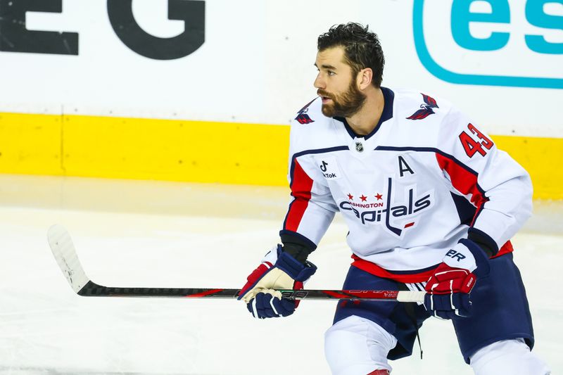Jan 23, 2026; Calgary, Alberta, CAN; Washington Capitals right wing Tom Wilson (43) skates during the warmup period against the Calgary Flames at Scotiabank Saddledome. Mandatory Credit: Sergei Belski-Imagn Images
