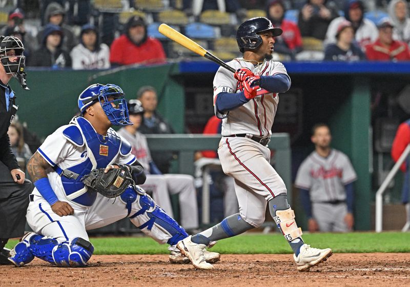 Apr 15, 2023; Kansas City, Missouri, USA;  Atlanta Braves second baseman Ozzie Albies (1) hits a two run single during the eighth inning against the Kansas City Royals at Kauffman Stadium. Mandatory Credit: Peter Aiken-USA TODAY Sports