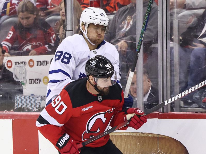 Oct 10, 2024; Newark, New Jersey, USA; New Jersey Devils left wing Tomas Tatar (90) hits Toronto Maple Leafs right wing William Nylander (88) during the third period at Prudential Center. Mandatory Credit: Ed Mulholland-Imagn Images