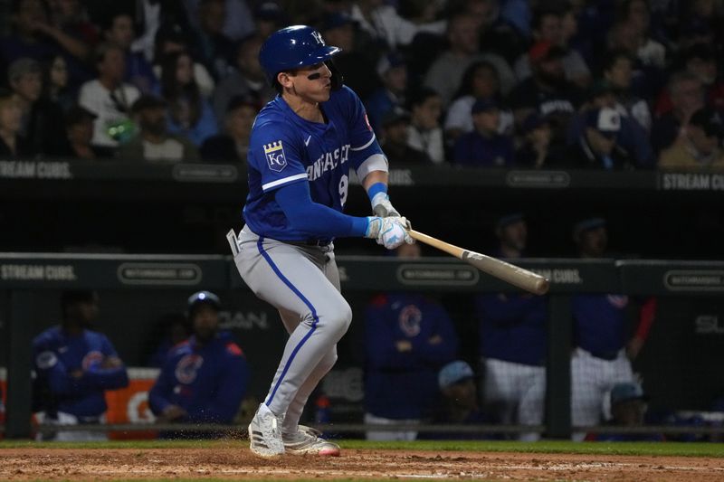 Mar 6, 2025; Mesa, Arizona, USA; Kansas City Royals Cam Devanney hits against the Chicago Cubs in the third inning at Sloan Park. Mandatory Credit: Rick Scuteri-Imagn Images