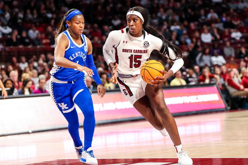 Feb 2, 2023; Columbia, South Carolina, USA; South Carolina Gamecocks forward Laeticia Amihere (15) drives around Kentucky Wildcats guard Robyn Benton (1) in the first half at Colonial Life Arena. Mandatory Credit: Jeff Blake-USA TODAY Sports