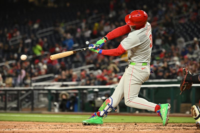 Apr 5, 2024; Washington, District of Columbia, USA; Philadelphia Phillies first baseman Bryce Harper (3) hits the ball against the Washington Nationals during the seventh inning at Nationals Park. Mandatory Credit: Rafael Suanes-USA TODAY Sports