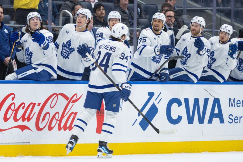 Dec 11, 2023; Elmont, New York, USA; Toronto Maple Leafs center Auston Matthews (34) celebrates his goal against the New York Islanders during the first period at UBS Arena. Mandatory Credit: Thomas Salus-USA TODAY Sports