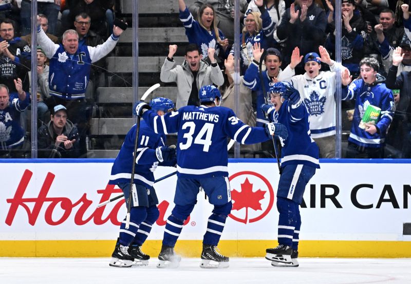 Mar 23, 2024; Toronto, Ontario, CAN; Toronto Maple Leafs forward Pontus Holmberg (29) celebrates with forwards Auston Matthews (34) and Max Domi (11) after scoring a goal against the Edmonton Oilers in the second period at Scotiabank Arena. Mandatory Credit: Dan Hamilton-USA TODAY Sports