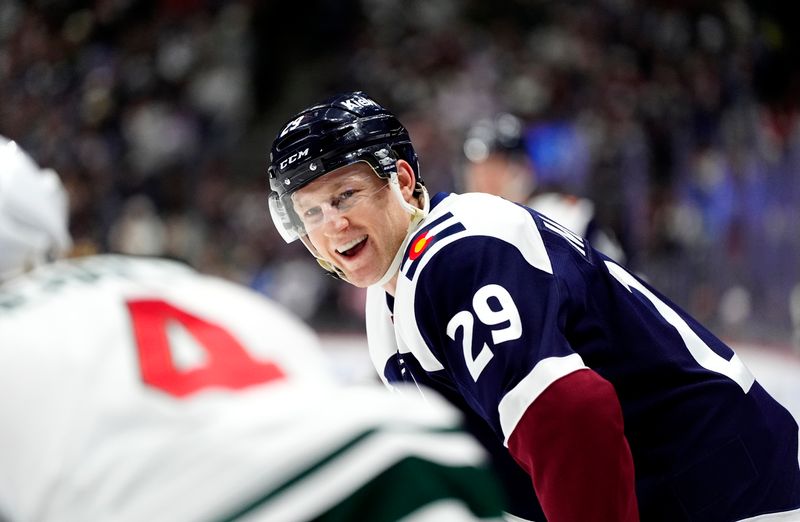 Jan 20, 2025; Denver, Colorado, USA; Colorado Avalanche center Nathan MacKinnon (29) reacts in the second period against the Minnesota Wild at Ball Arena. Mandatory Credit: Ron Chenoy-Imagn Images