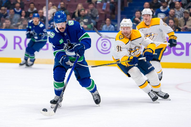 Nov 17, 2024; Vancouver, British Columbia, CAN; Nashville Predators forward Steven Stamkos (91) stick checks Vancouver Canucks forward Conor Garland (8) during the first period at Rogers Arena. Mandatory Credit: Bob Frid-Imagn Images