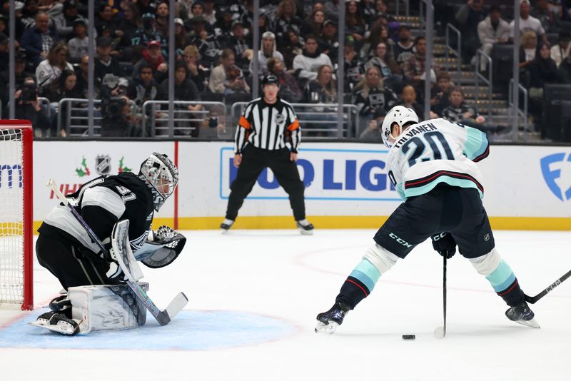 Nov 23, 2024; Los Angeles, California, USA;  Seattle Kraken right wing Eeli Tolvanen (20) shoots against Los Angeles Kings goaltender David Rittich (31) during the first period at Crypto.com Arena. Mandatory Credit: Kiyoshi Mio-Imagn Images