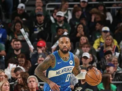 MILWAUKEE, WI - NOVEMBER 24: Damian Lillard #0 of the Milwaukee Bucks brings the ball up court against the Washington Wizards during the In-Season Tournament on November 24, 2023 at the Fiserv Forum Center in Milwaukee, Wisconsin. NOTE TO USER: User expressly acknowledges and agrees that, by downloading and or using this Photograph, user is consenting to the terms and conditions of the Getty Images License Agreement. Mandatory Copyright Notice: Copyright 2023 NBAE (Photo by Gary Dineen/NBAE via Getty Images).