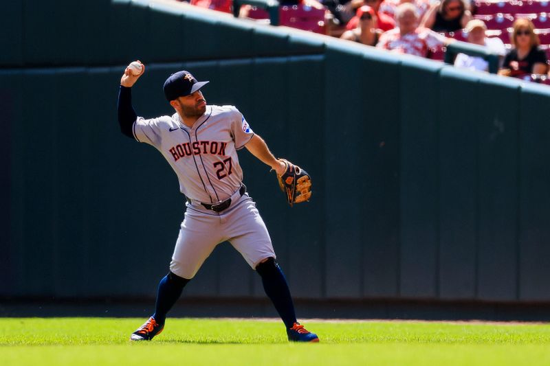 Sep 5, 2024; Cincinnati, Ohio, USA; Houston Astros second baseman Jose Altuve (27) throws to first to get Cincinnati Reds outfielder TJ Friedl (not pictured) out in the first inning at Great American Ball Park. Mandatory Credit: Katie Stratman-Imagn Images