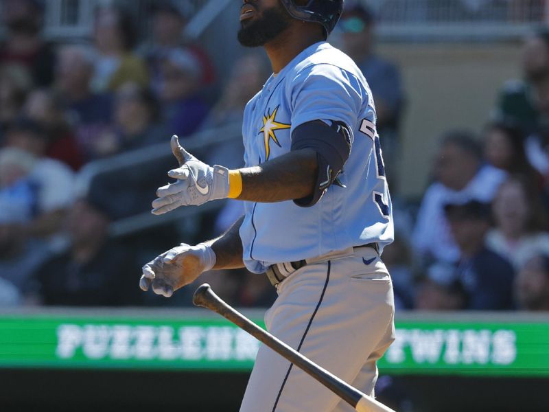 Sep 13, 2023; Minneapolis, Minnesota, USA; Tampa Bay Rays left fielder Randy Arozarena (56) tosses his bat after hitting a solo home run against the Minnesota Twins in the ninth inning at Target Field. Mandatory Credit: Bruce Kluckhohn-USA TODAY Sports