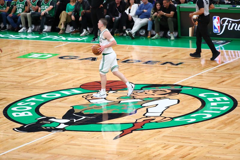 BOSTON, MA - MAY 21: Payton Pritchard #11 of the Boston Celtics dribbles the ball during the game against the Indiana Pacers during Game 1 of the Eastern Conference Finals of the 2024 NBA Playoffs on May 21, 2024 at the TD Garden in Boston, Massachusetts. NOTE TO USER: User expressly acknowledges and agrees that, by downloading and or using this photograph, User is consenting to the terms and conditions of the Getty Images License Agreement. Mandatory Copyright Notice: Copyright 2024 NBAE  (Photo by David L. Nemec/NBAE via Getty Images)