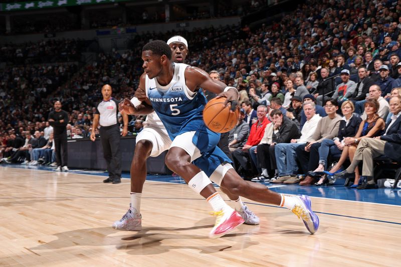 MINNEAPOLIS, MN -  MARCH 22: Anthony Edwards #5 of the Minnesota Timberwolves handles the ball during the game against the Cleveland Cavaliers on March 22, 2024 at Target Center in Minneapolis, Minnesota. NOTE TO USER: User expressly acknowledges and agrees that, by downloading and or using this Photograph, user is consenting to the terms and conditions of the Getty Images License Agreement. Mandatory Copyright Notice: Copyright 2024 NBAE (Photo by David Sherman/NBAE via Getty Images)