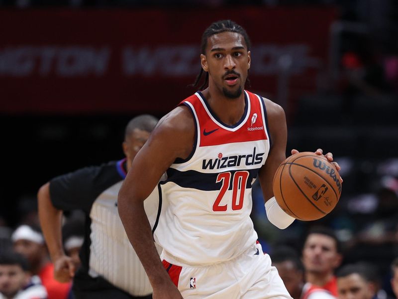 WASHINGTON, DC - OCTOBER 11: Alex Sarr #20 of the Washington Wizards dribbles the ball against the Toronto Raptors during the first half of a preseason game at Capital One Arena on October 11, 2024 in Washington, DC. NOTE TO USER: User expressly acknowledges and agrees that, by downloading and or using this photograph, User is consenting to the terms and conditions of the Getty Images License Agreement. (Photo by Patrick Smith/Getty Images)