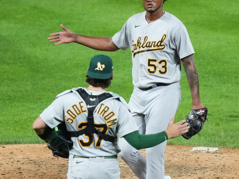 Jul 29, 2023; Denver, Colorado, USA; Oakland Athletics relief pitcher Angel Felipe (53) and catcher Tyler Soderstrom (37) celebrate after defeating the Colorado Rockies at Coors Field. Mandatory Credit: Ron Chenoy-USA TODAY Sports