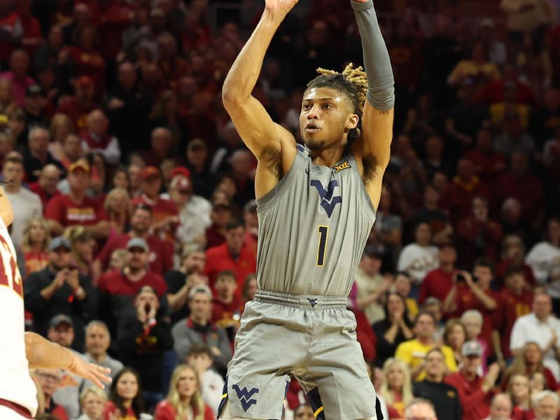 Feb 24, 2024; Ames, Iowa, USA; West Virginia Mountaineers guard Noah Farrakhan (1) shoots against the Iowa State Cyclones during the second half at James H. Hilton Coliseum. Mandatory Credit: Reese Strickland-USA TODAY Sports