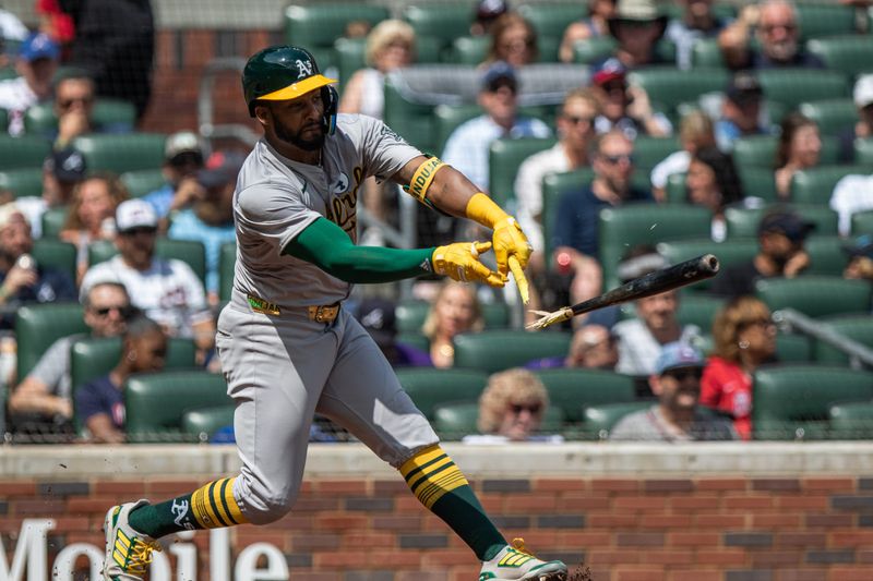 Jun 2, 2024; Cumberland, Georgia, USA;   Oakland Athletics outfielder Miguel Andujar (22)  split bat while hitting ground ball against the Oakland Athletics during the eighth inning at Truist Park Mandatory Credit: Jordan Godfree-USA TODAY Sports