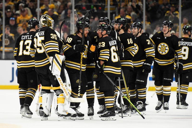 Apr 6, 2024; Boston, Massachusetts, USA; the Boston Bruins celebrate their overtime win over the Florida Panthers at TD Garden. Mandatory Credit: Bob DeChiara-USA TODAY Sports