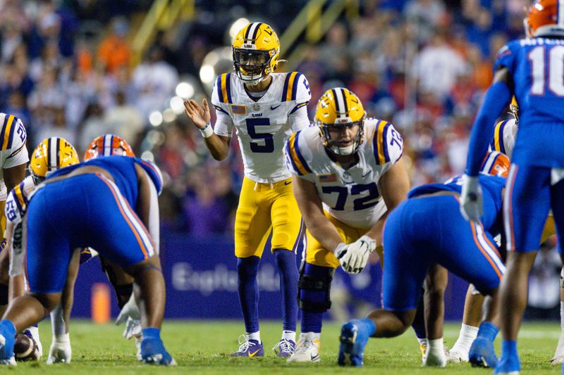 Nov 11, 2023; Baton Rouge, Louisiana, USA;  LSU Tigers quarterback Jayden Daniels (5) calls for the ball against the Florida Gators during the first half at Tiger Stadium. Mandatory Credit: Stephen Lew-USA TODAY Sports